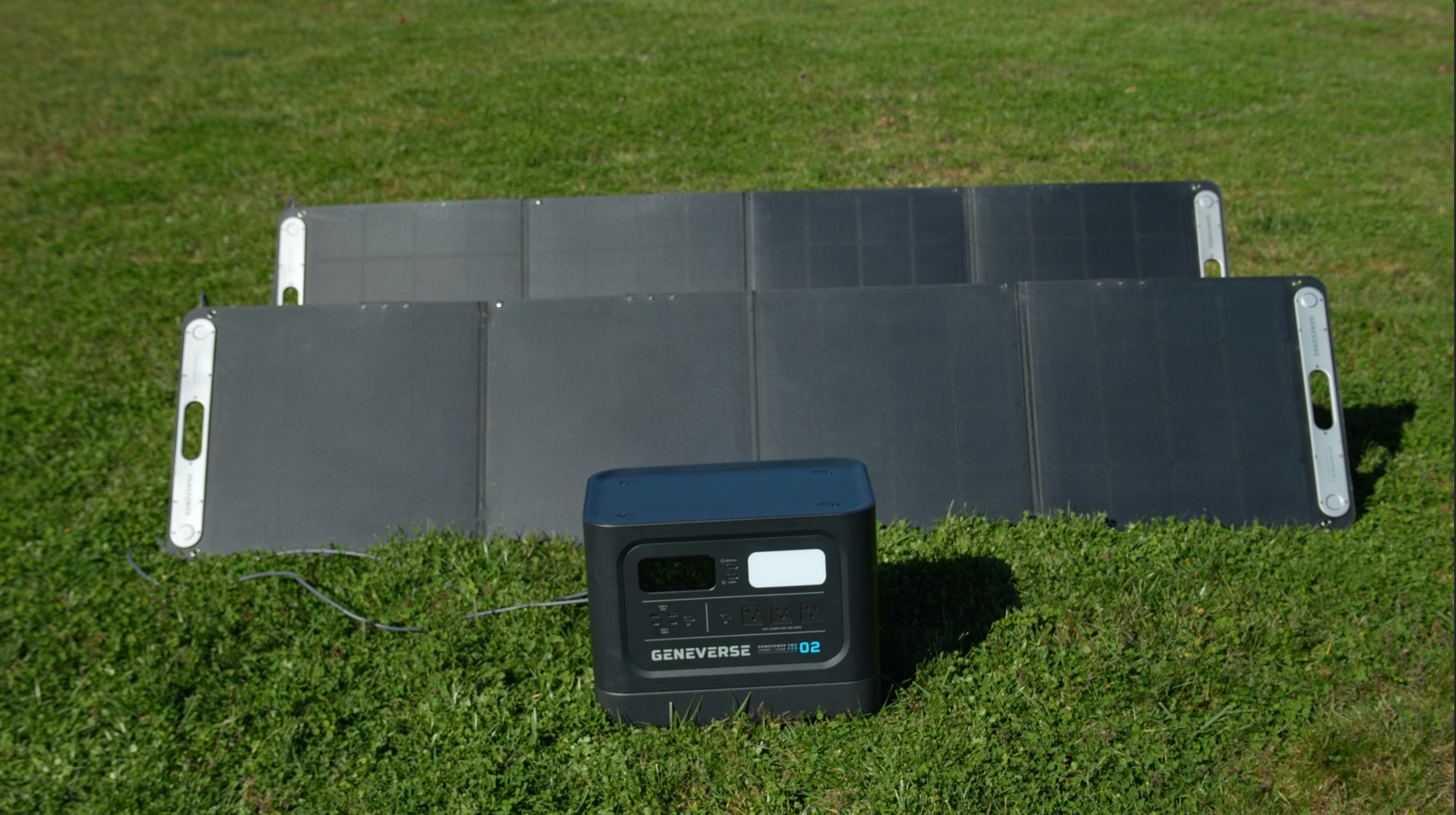 The Geneverse HomePower Two PRO with Geneverse solar panels in a sunny field