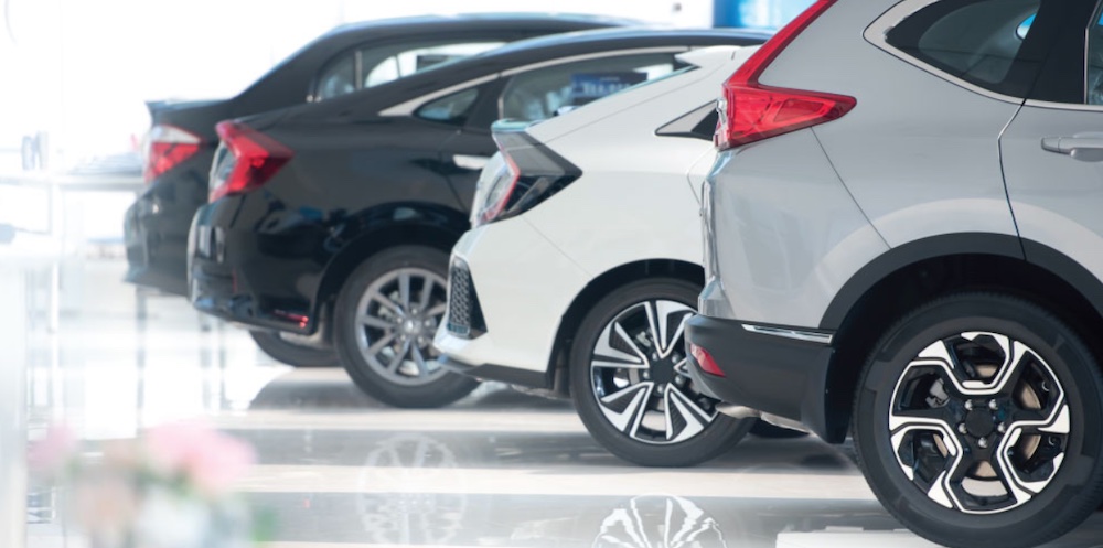 Line of cars parked in a dealership