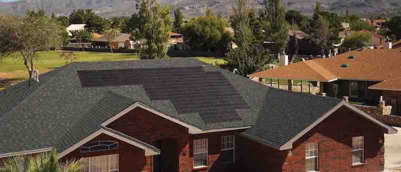 A home with CertainTeed Solstic shingles installed on it